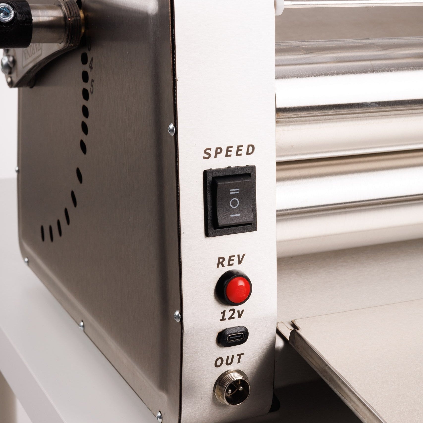 Control panel of a machine with switches and labels on a white background