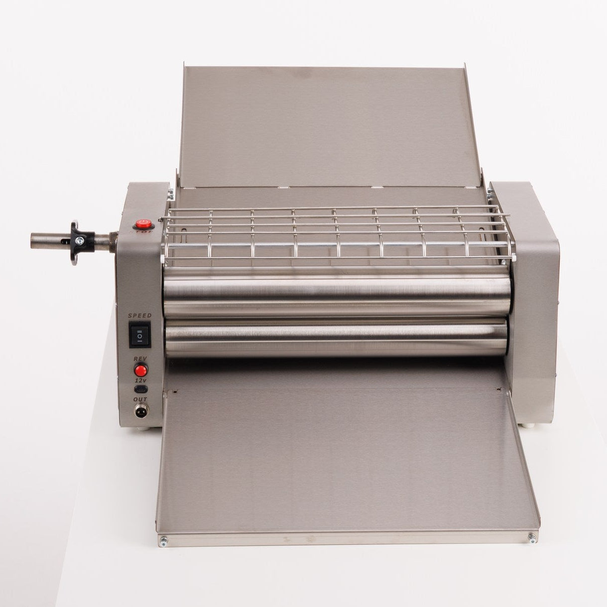 Roller machine on a white table with a white background