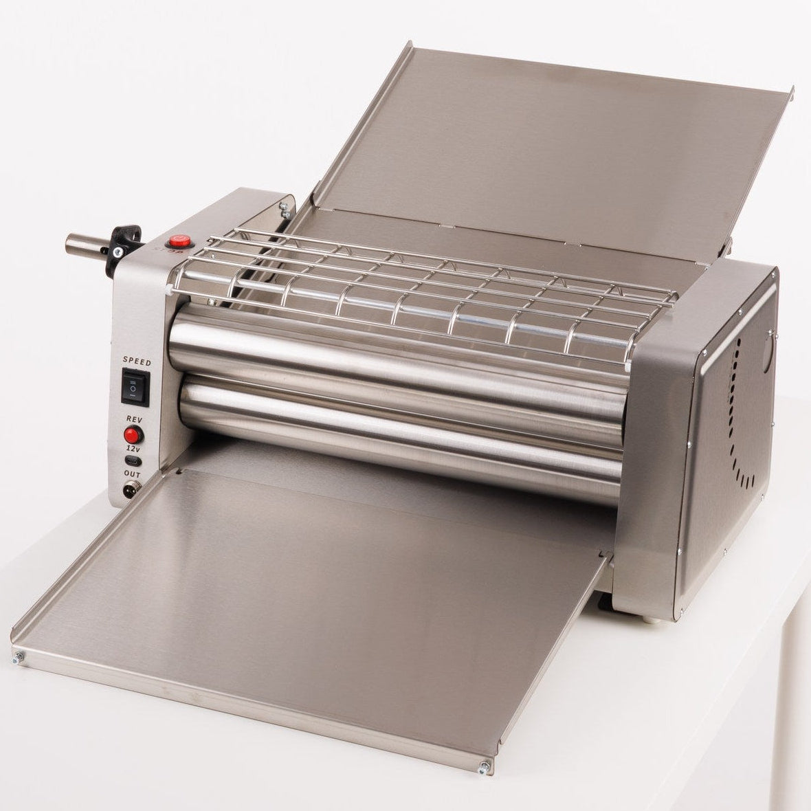 Stainless steel dough sheeter on a white background