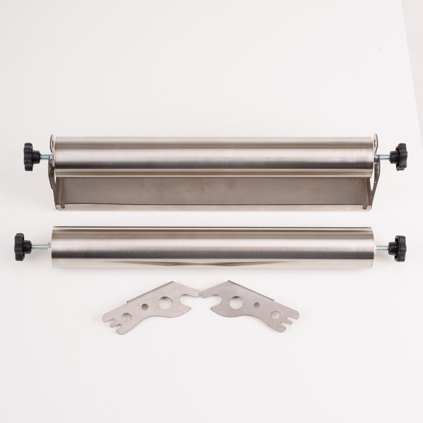 Two metal rollers and a metal bracket on a white background